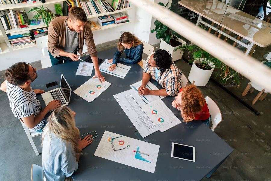 Team collaborating on an SEO and digital marketing strategy around a table