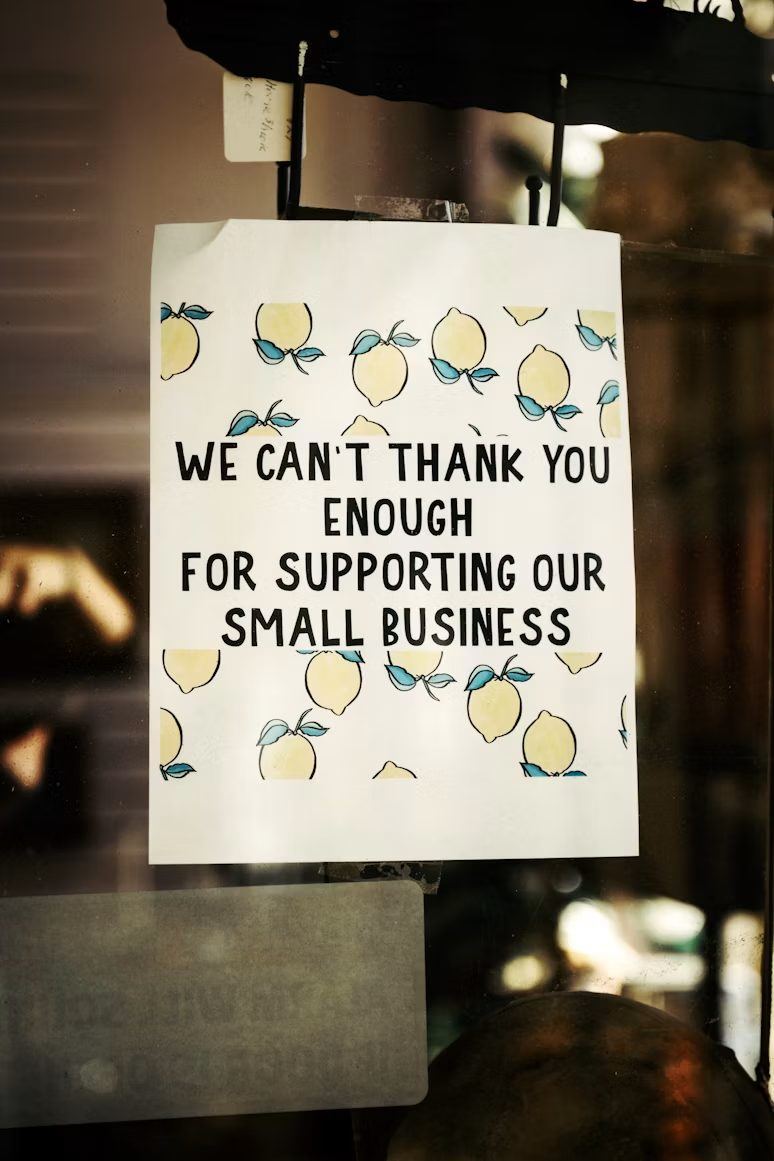 Small business shop window sign thanking customers for supporting local businesses
